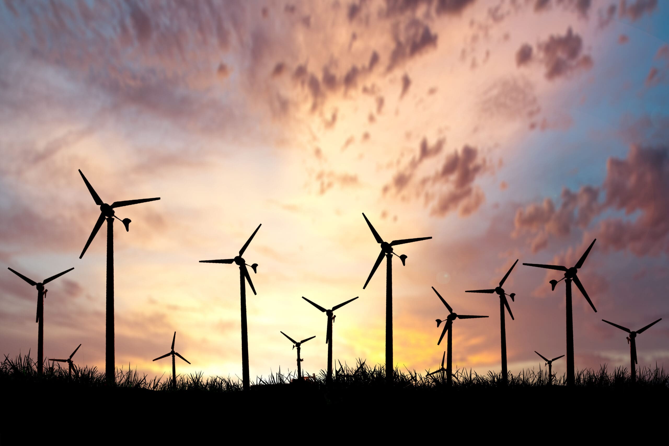 A windmill farm at sunset.