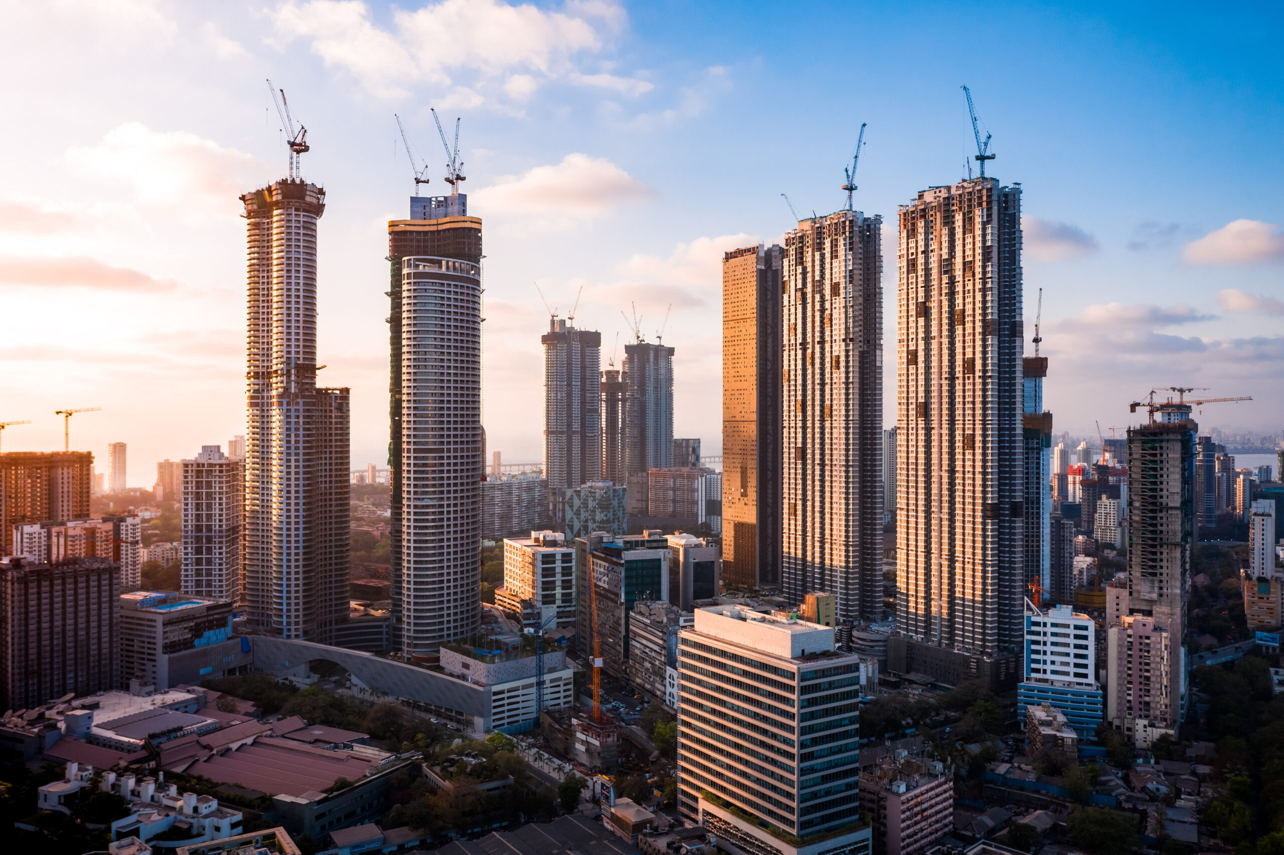 Skyscrapers in a cityscape at dusk.