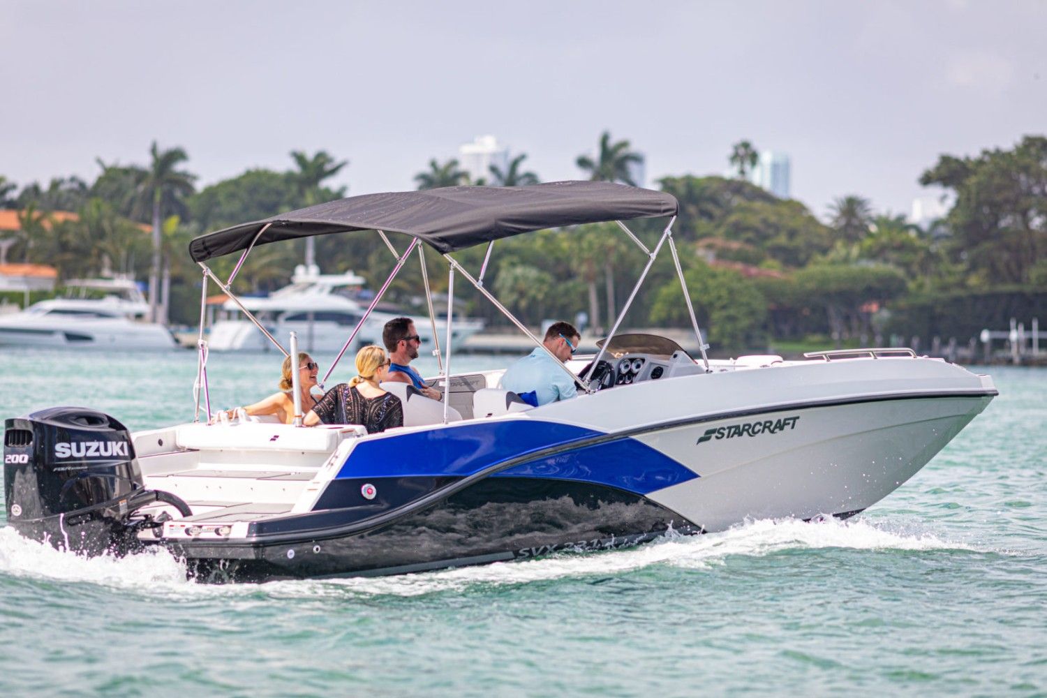 A speedboat travels across water.