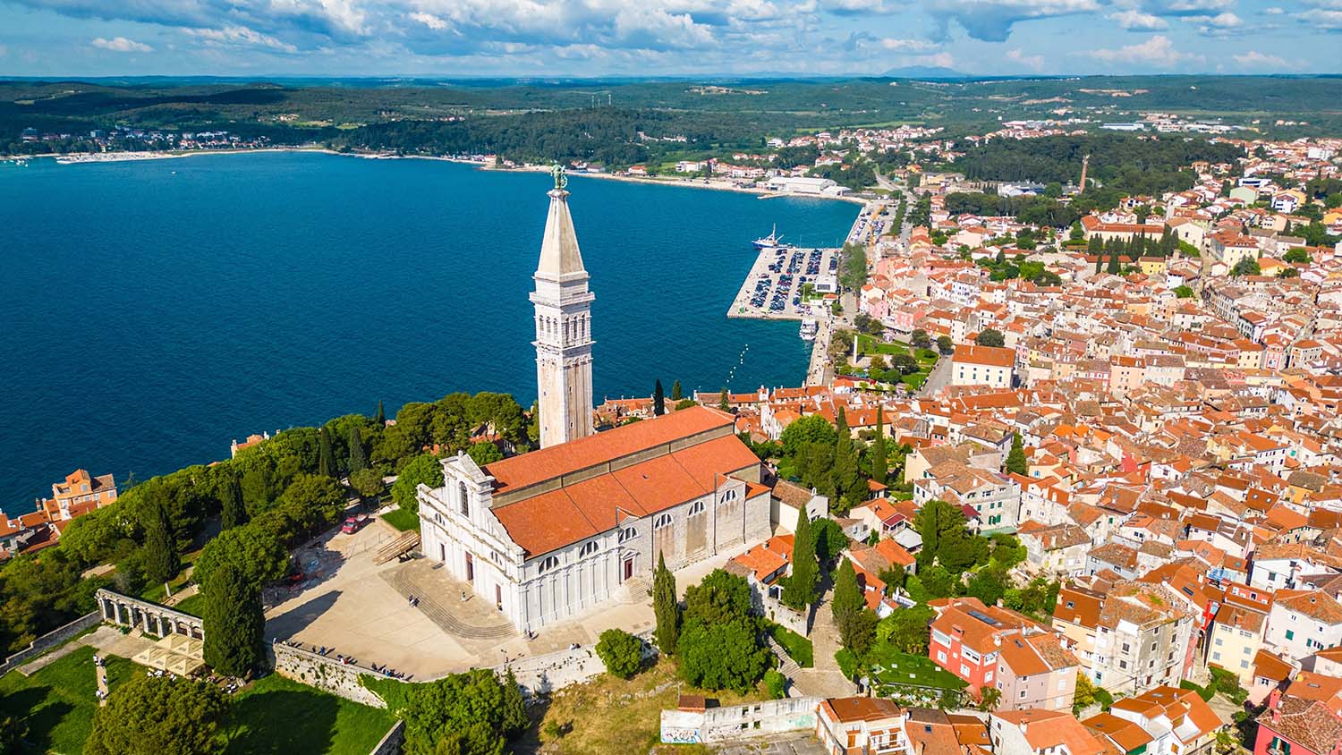 Aerial shot of a picturesque coastal town in the summer.