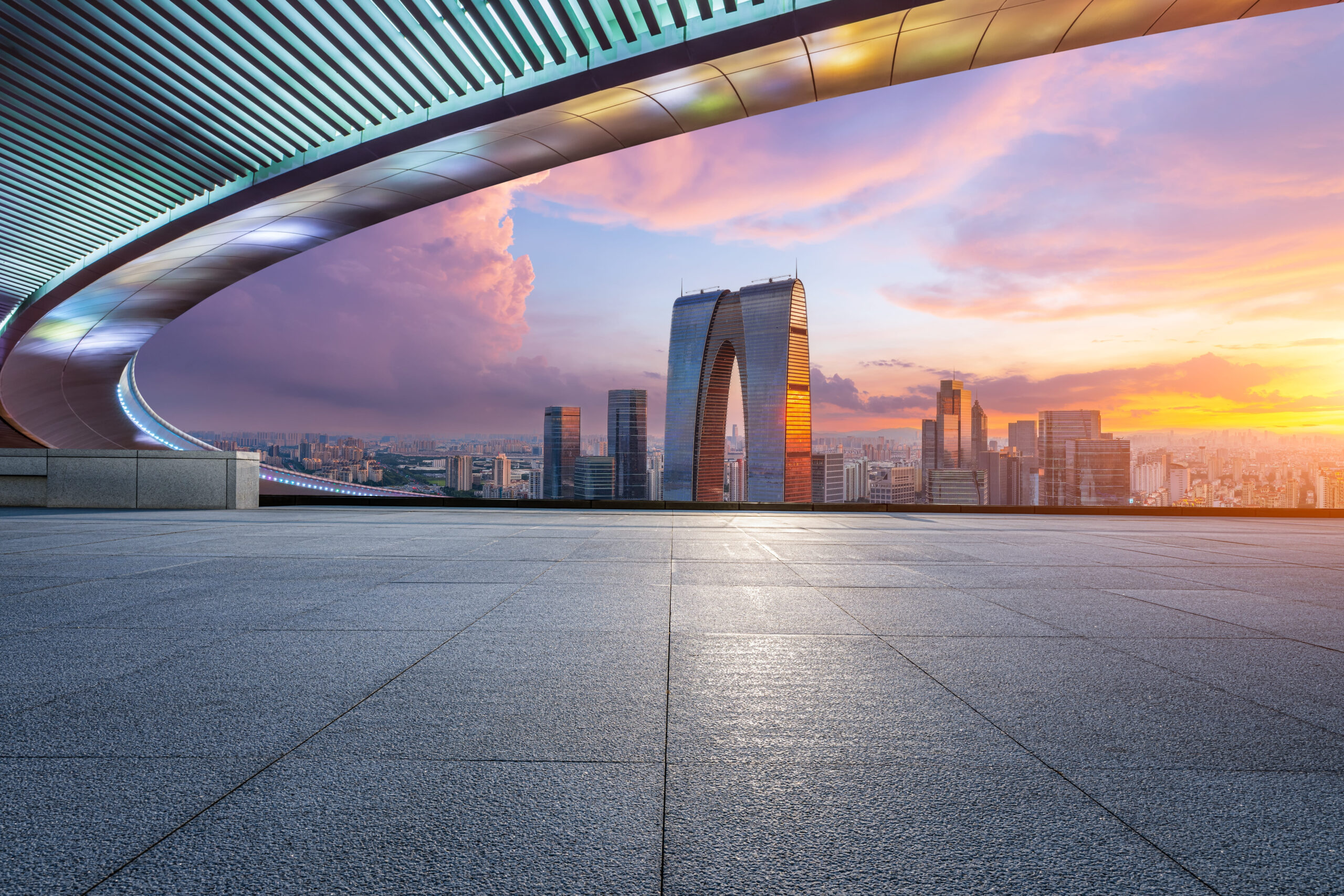 Empty floor and modern city skyline with building at sunset in Suzhou, China. high angle view.