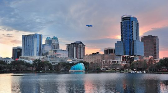 Orlando Lake Eola sunset with urban architecture skyline and colorful cloud