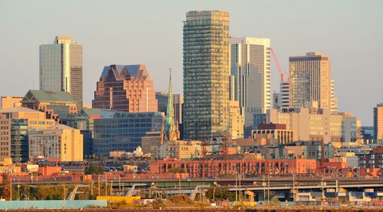 Toronto sunrise with sunlight reflection over lake in the morning